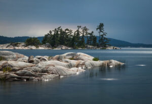 Storm Light Light on McGregor Bay, Ontario, Canada -- with storm clouds in the distance. A 20-second exposure. (Steve Sickels)